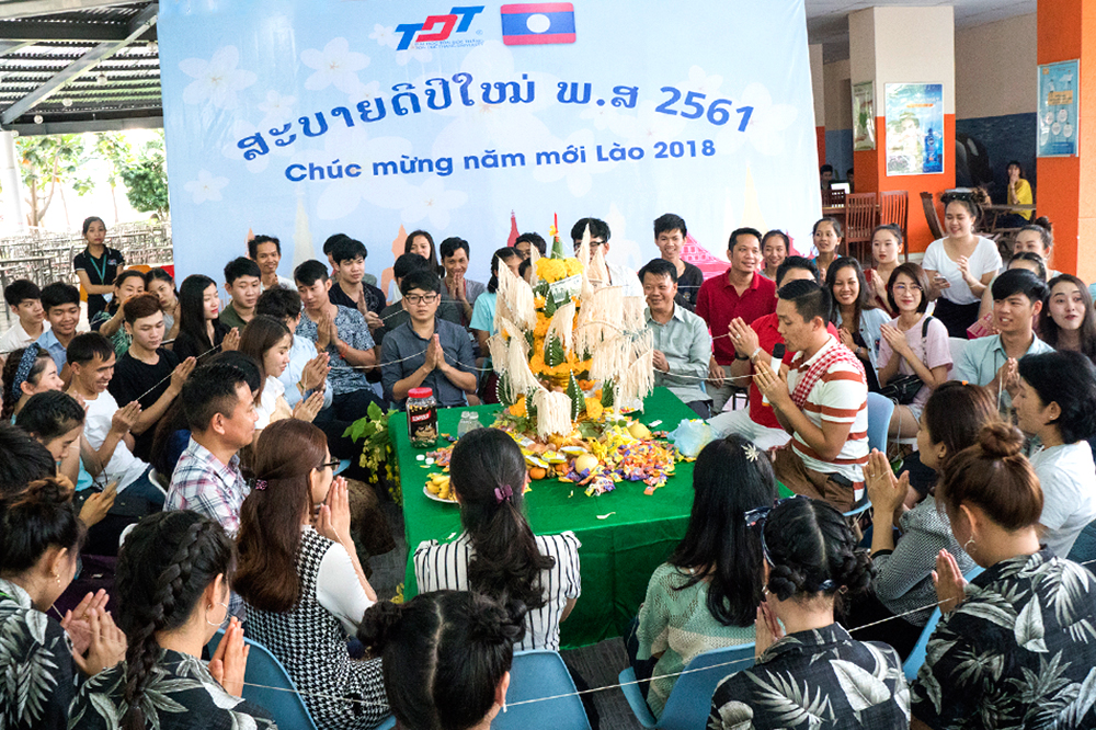Laotian - Thai students celebrating traditional BunPiMay Festival at TDTU